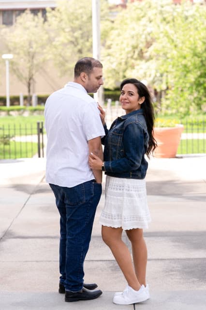 Engagement session, a quiet moment on the sidewalk.
