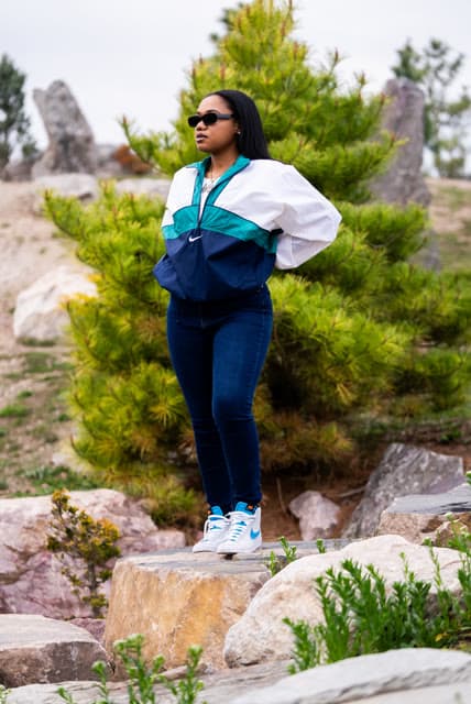 Personal brand session, standing on a rock formation.